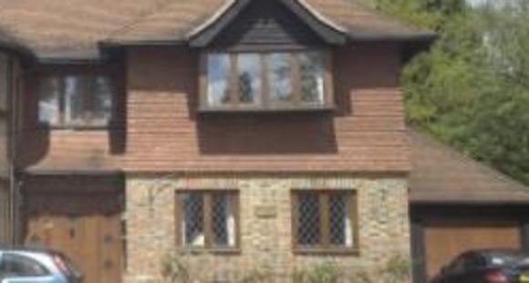 Brick and Tile clad timber frame house Woodward Chartered Surveyors