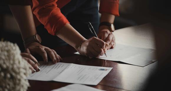 Man signing legal document